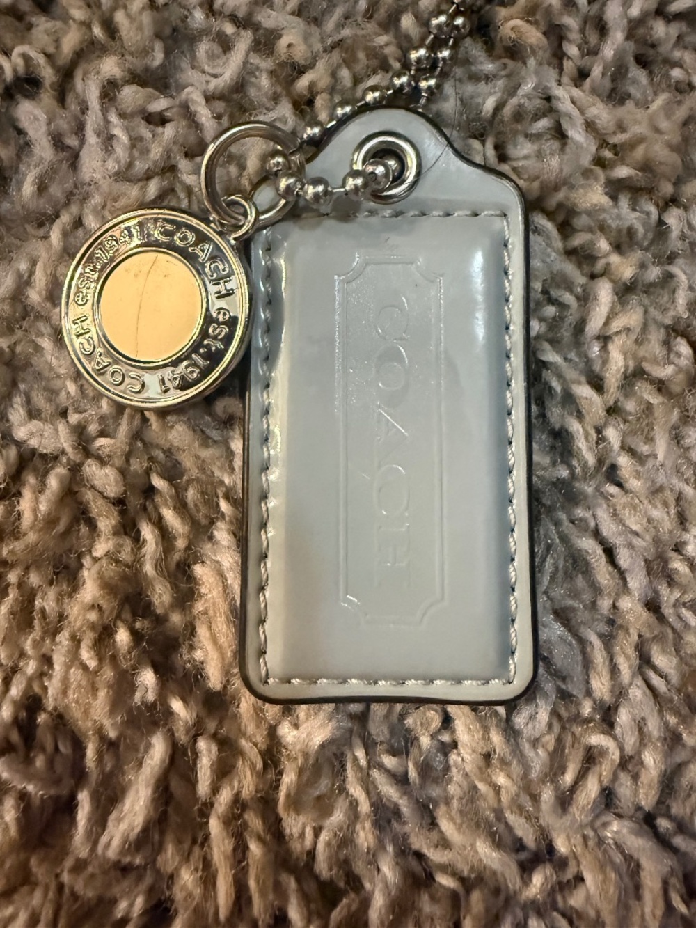 Coach medallion and hang tag